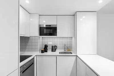a microwave oven sitting inside of a kitchen at Bright Apartment with Balcony & Parking | Bonfim in Porto