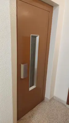 a brown door with a mirror on it at Elegance in Porto in Porto