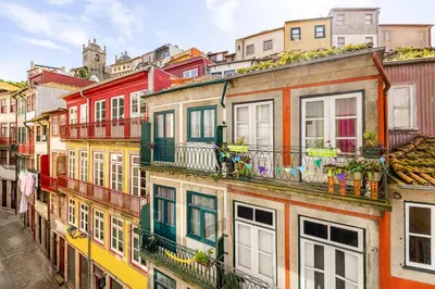 a living room with a table and a couch at Charming & Sunny Stay in Historic Porto in Porto