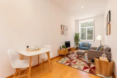 a living room with a table and a couch at YOUROPO - Cosy in Porto