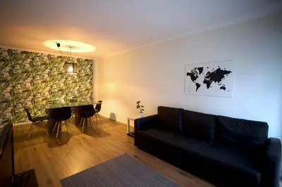 a living room with a couch and a table at 2Bedroom Flat - Families, remote work, downtown - Private Garage in Porto