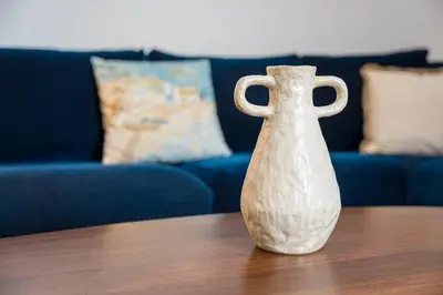 a white vase sitting on top of a table at GuestReady - enjoy the Best of Porto in Porto