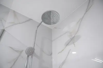 two lights on a ceiling with white marble at GuestReady - enjoy the Best of Porto in Porto