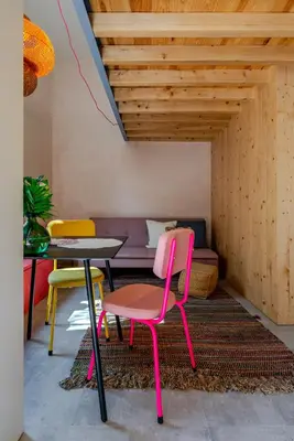 a kitchen with a sink and wooden walls and cabinets at Kleine's House in Porto - Mezzanine Boavista in Porto