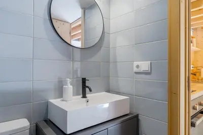 a kitchen with a sink and a stove at Kleine's House in Porto - Mezzanine Boavista in Porto