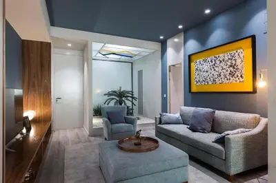 a living room with a couch and a table at Charming Flat - Garage by Host Wise in Porto