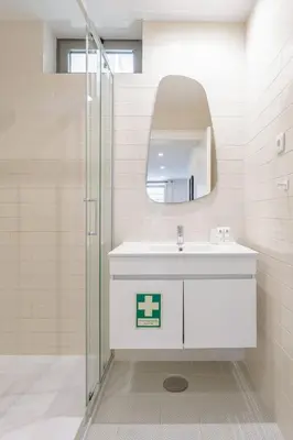 a bathroom with a sink and a mirror at Bright & Characterful Home by HostWise in Porto