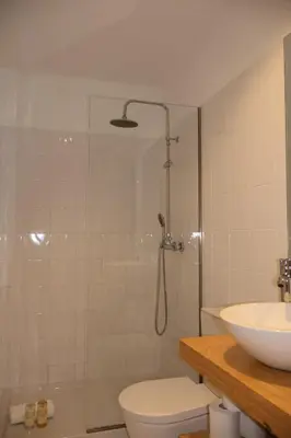a bathroom with a sink and a toilet at Porto Central Apartment in Porto