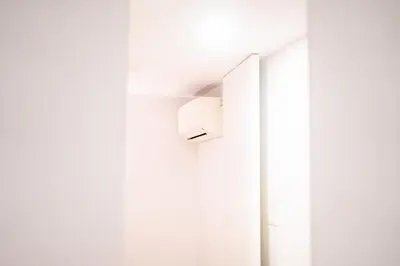 a white wall with a paper towel dispenser on a wall at Magnificent Cais de Gaia Duplex in Vila Nova de Gaia