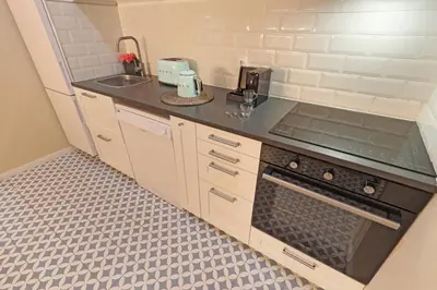 a small kitchen with a sink and a stove at ON Apartments - Family - Free Parking & Pet Friendly in Porto