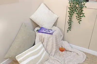 a pile of pillows sitting on the floor in a room at ON Apartments - Family - Free Parking & Pet Friendly in Porto
