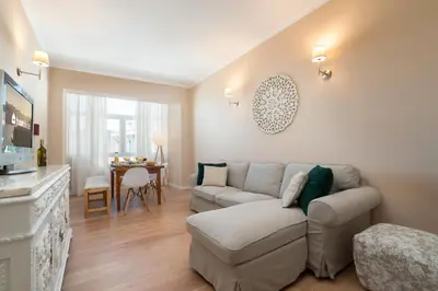 a living room with a couch and a table at The Heritage Flat in Porto
