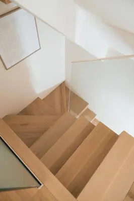 a room with a wooden staircase with a glass wall at Casa de Santa Catarina by OportoSoul in Porto