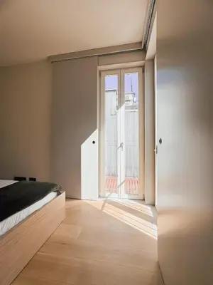a bedroom with a bed and a large window at Casa de Santa Catarina by OportoSoul in Porto