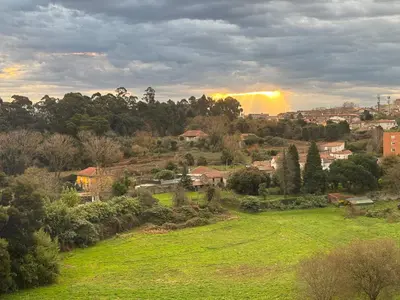 a view of a city with a rainbow in the background at Skyline Heaven - Fantastic View - Pool - Garage in Vila Nova de Gaia