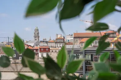 a view of a city from behind some buildings at GuestReady - Elegant stay in Central Porto in Porto