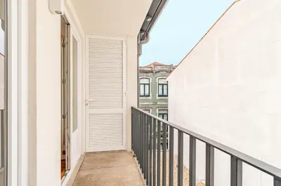an empty corridor of a building with a balcony at Oporto Center Studio in Porto