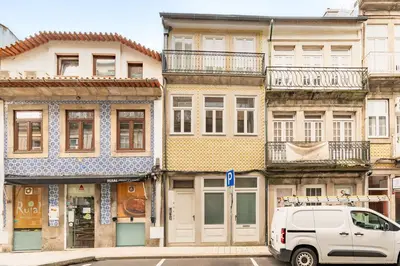 a white van parked in front of buildings at Oporto Center Studio in Porto