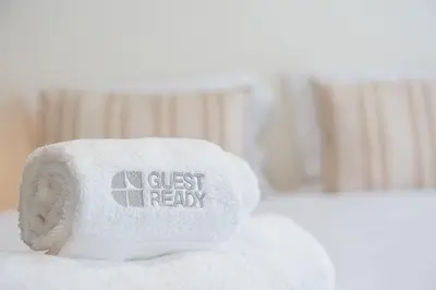 a roll of toilet paper sitting on top of a bed at GuestReady - cosy retreat in Vila Nova de Gaia in Vila Nova de Gaia