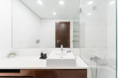 a white bathroom with a sink and a tub at GuestReady - cosy retreat in Vila Nova de Gaia in Vila Nova de Gaia