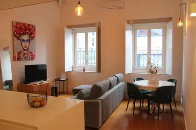a living room with a couch and a table at ALMADA LOFT LIVING by We Do Living in Porto