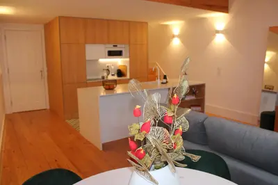 a living room and kitchen with a christmas tree at ALMADA LOFT LIVING by We Do Living in Porto