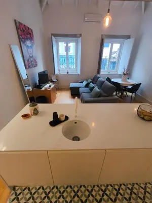 a living room with a couch and a table at ALMADA LOFT LIVING by We Do Living in Porto