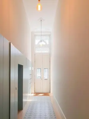 a hallway with a white door with a window at Classic loft in fully renewed building at Batalha in Porto