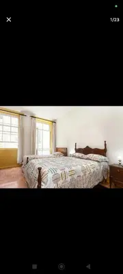 a bedroom with a large bed and a window at portochique AL7 in Porto