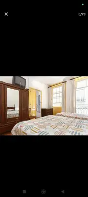 a bedroom with a bed and a dresser and window at portochique AL7 in Porto