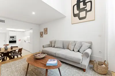 a living room with a couch and a table at Unique Luxury and Quiet in Porto Best Location in Porto