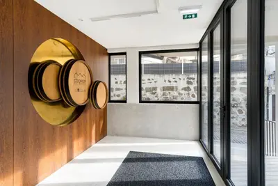 a tasting room with wine barrels on the wall at GuestReady - comfort near Jardim do Morro in Vila Nova de Gaia
