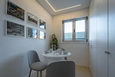 a dining room with a table and chairs at T4 ForYou Oporto Downtown in Porto