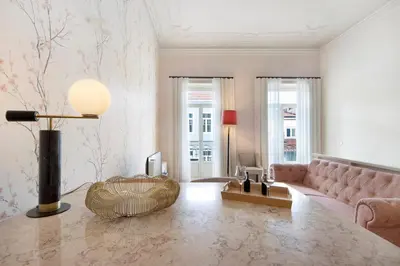 a living room with a couch and a table at Alma D'oporto 556 – Elegant T1 in Porto