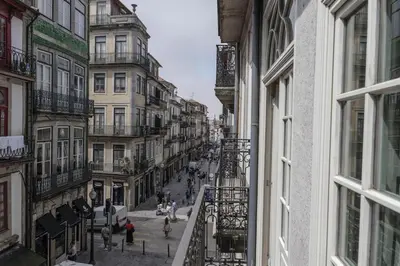 a view of a city street from a window at Modern Flat With Balcony on Rua das Flores - 1st in Porto