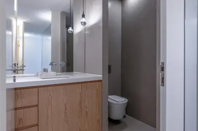 a bathroom with a sink and a toilet at Modern Flat with balcony on Rua das Flores - 2nd in Porto