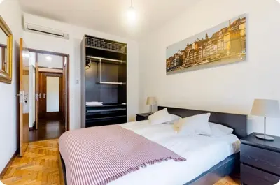a bedroom with a large white bed in a room at Full 3-Room Apt Downtown Casa do Livro Boavista in Porto