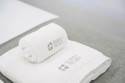 a stack of towels sitting on a table at GuestReady - Douro D'or Apartments in Vila Nova de Gaia