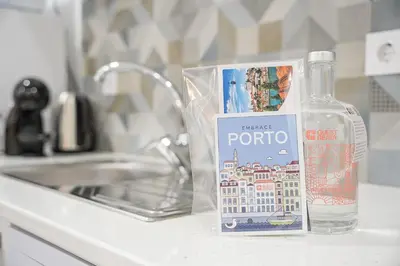 a bottle of water sitting next to a sink at GuestReady - Douro D'or Apartments in Vila Nova de Gaia