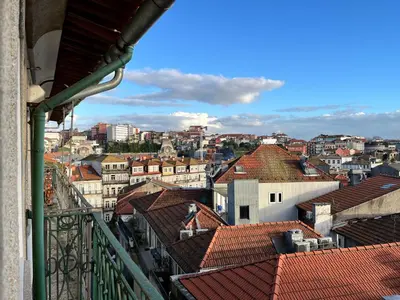 a view of a city from a balcony at Clérigos Cinema Guesthouse in Porto
