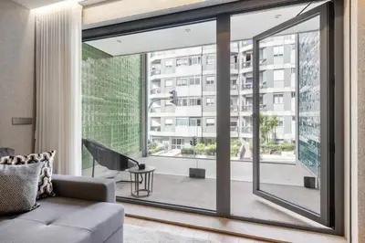 a bathroom with a white sink and a mirror at Avenue 104 @ Porto Renovato, Bonfim in Porto