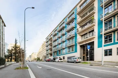 an empty street in a city with buildings at Avenue 104 @ Porto Renovato, Bonfim in Porto