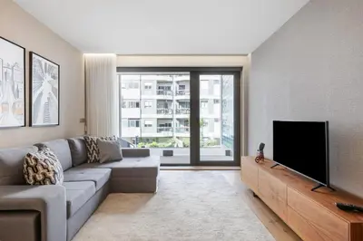 a bedroom with a large white bed and a window at Avenue 104 @ Porto Renovato, Bonfim in Porto