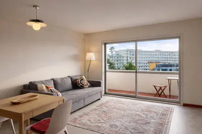 a living room with a couch and a table at Good View Studio in Porto