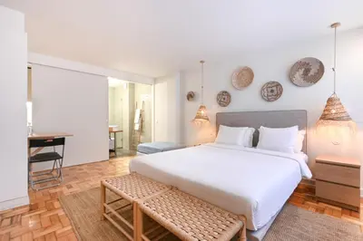 a bathroom with a sink and a mirror and a toilet at Sleep in Office by ON Apartments in Porto
