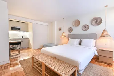 a bathroom with a sink and a mirror and a toilet at Sleep in Office by ON Apartments in Porto