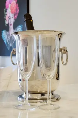 two empty wine glasses sitting on top of a table at Luxury Style 5 with AC Downtown Porto near Metro in Porto