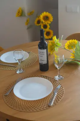 a white kitchen with a sink and a stove at Upper Story 1BR AC and Workspace in Porto