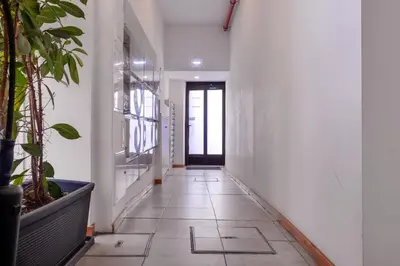 an empty hallway with plants and a door at Cozy Loft w Poll Near Porto Cellars in Vila Nova de Gaia
