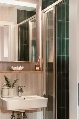 a bathroom with a sink and a shower at Apartment Nunno in Porto